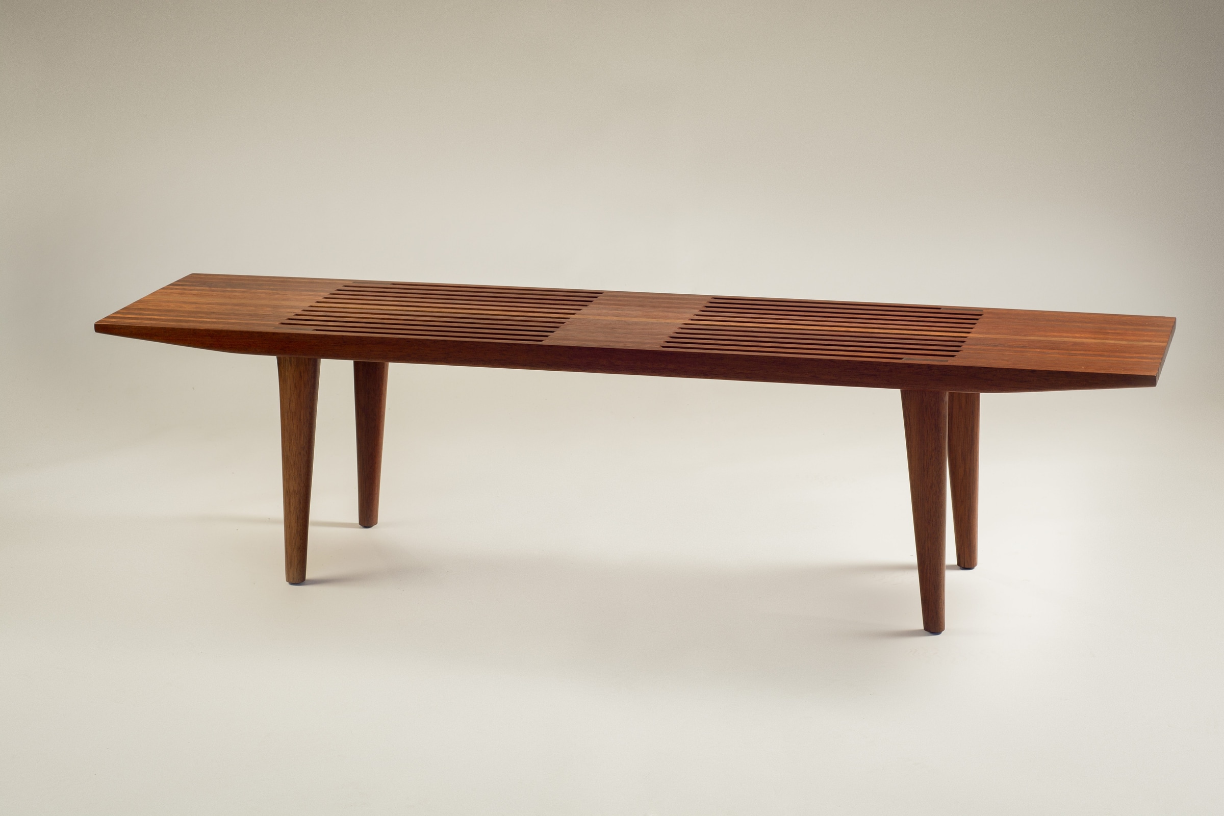Wooden bench shown from a three-quarter angle
