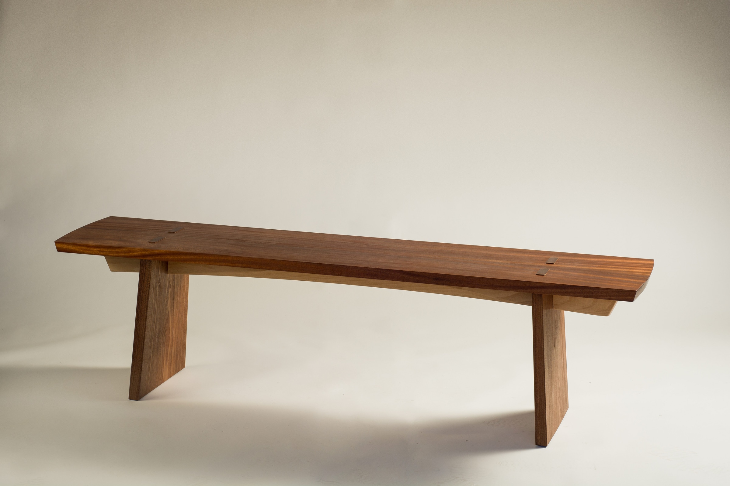 Wooden bench shown from a three-quarter angle