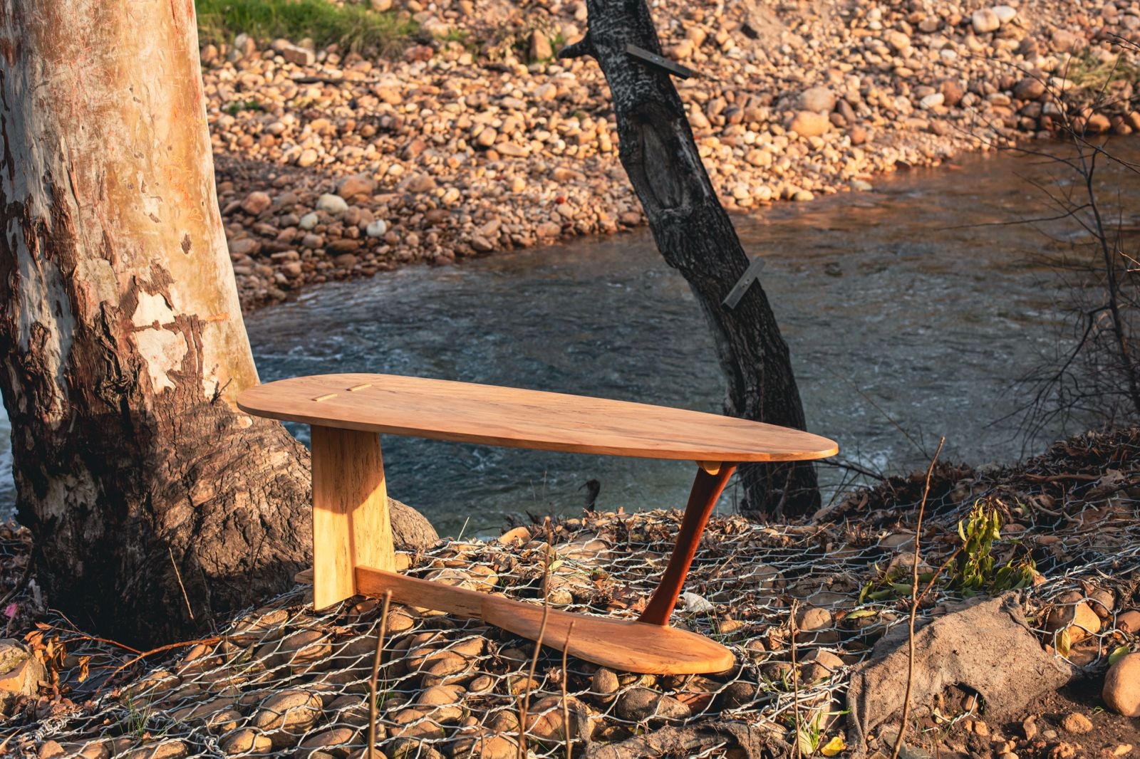 Reef Table showing the curved top, angled leg and lower stretcher